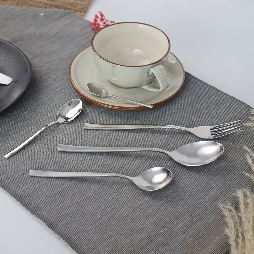 Set of stainless steel silver cutlery including forks, and spoon.